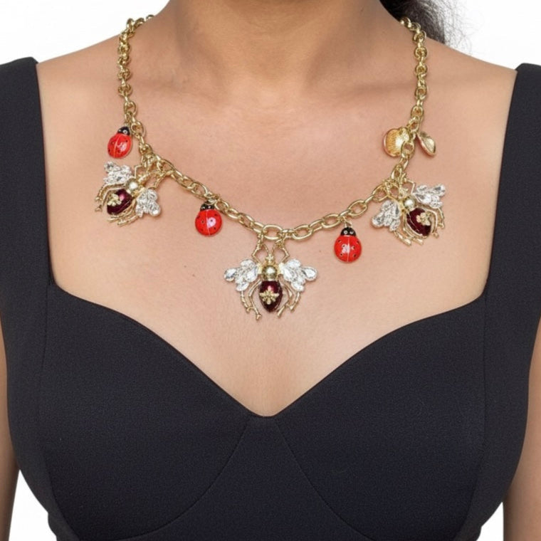 BeatleFly statement necklace flat lay with modern styling, unique Beatles and Housefly design