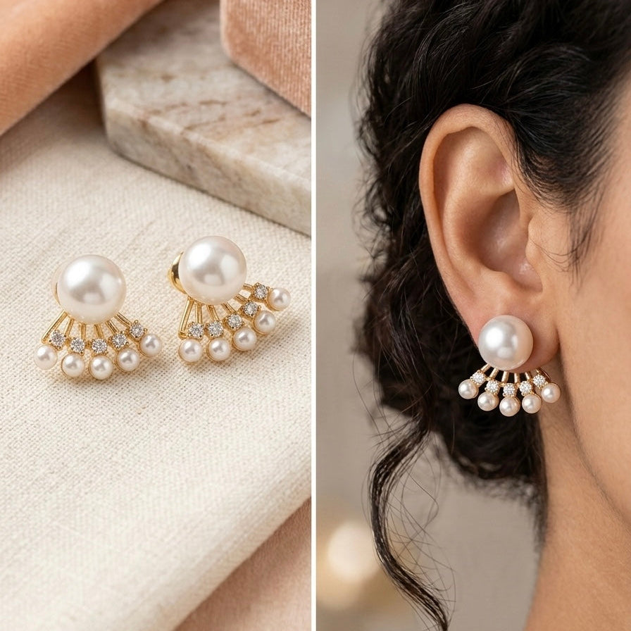 Pearl earrings with gold accents on a marble surface and worn by a person.