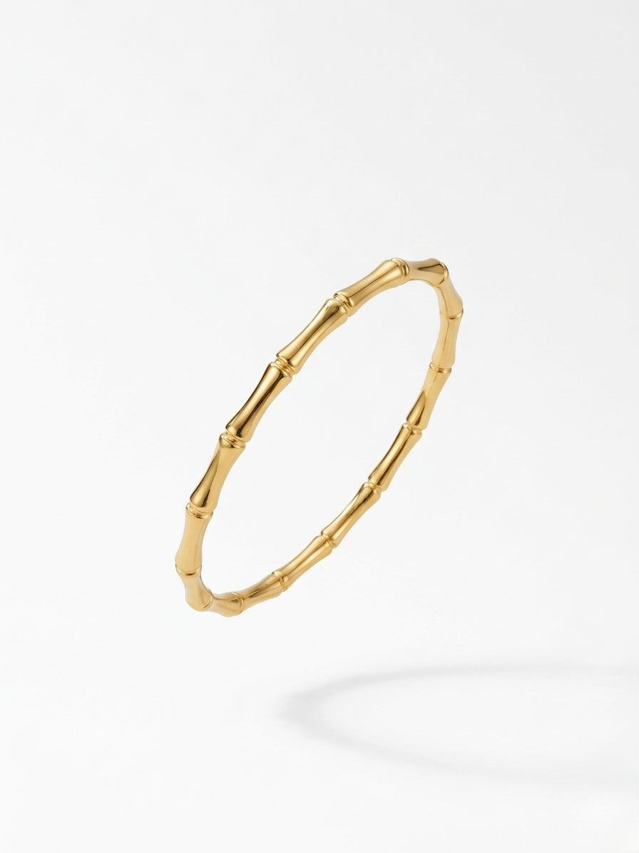 Gold bracelet on a white background